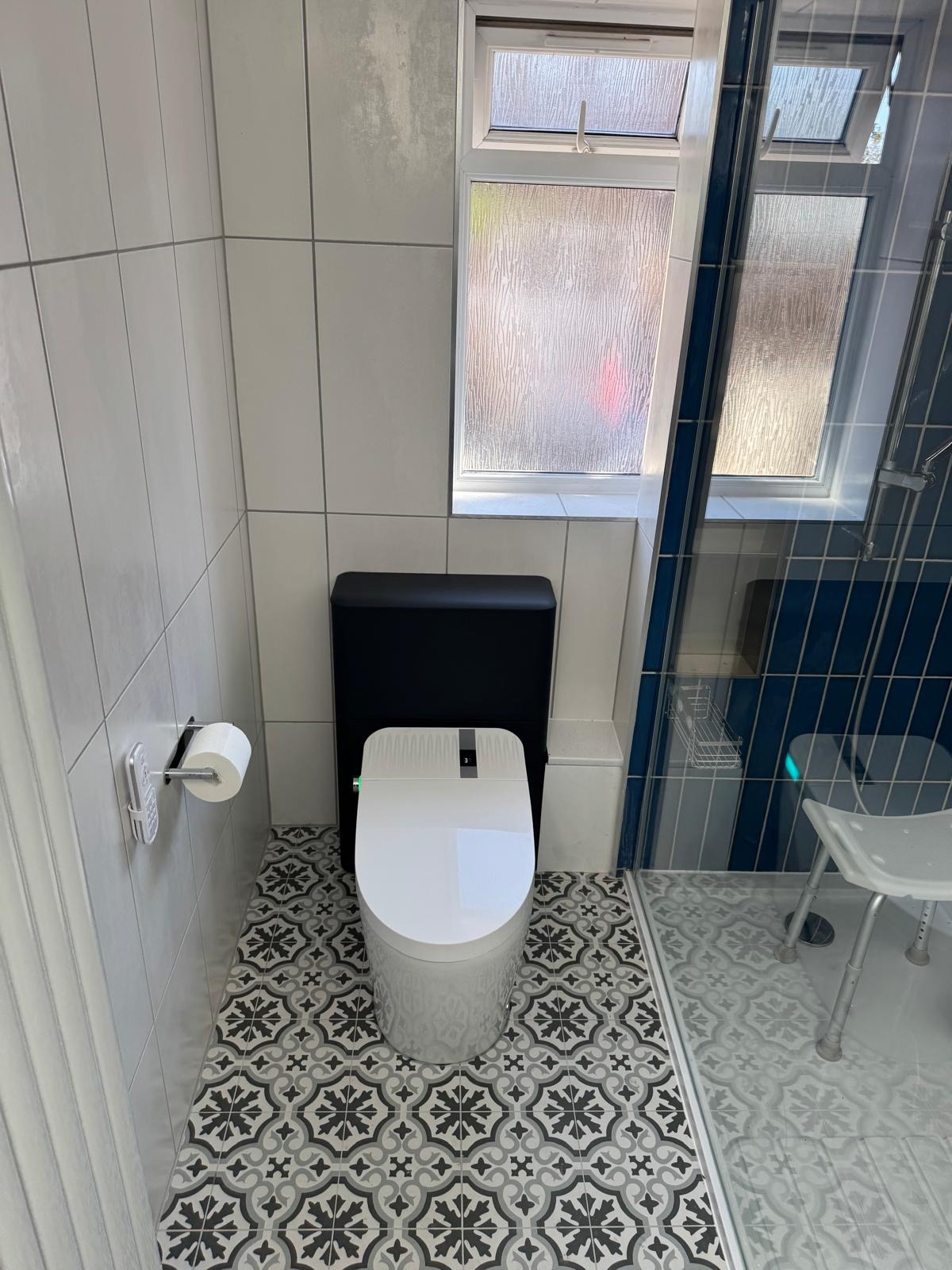 Close-coupled toilet with concealed cistern fitted in a refitted bathroom in Bedfordshire